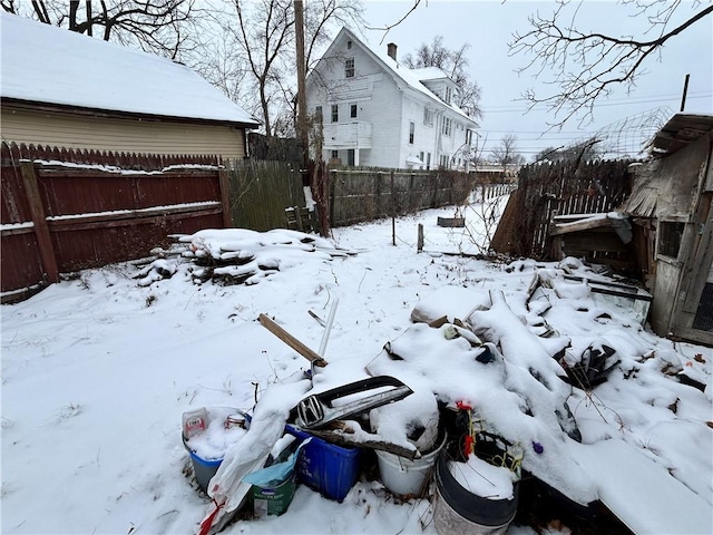 view of yard layered in snow