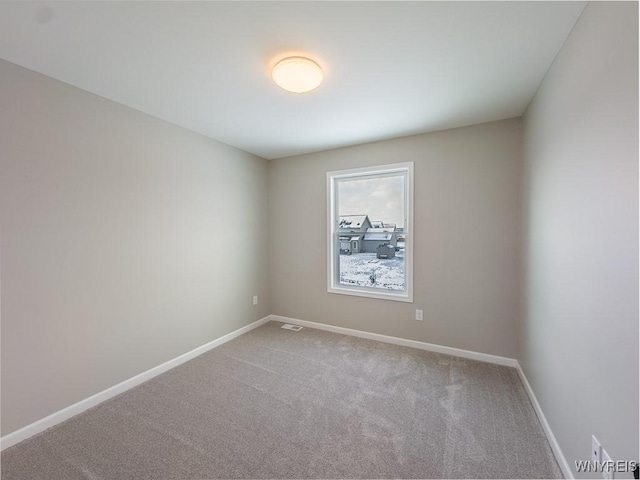 spare room featuring carpet flooring