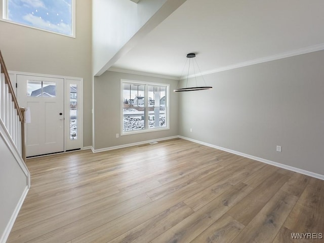 foyer entrance with light wood-type flooring