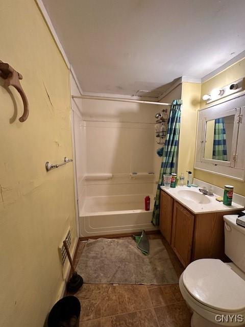 full bathroom featuring shower / bath combination with curtain, toilet, and vanity