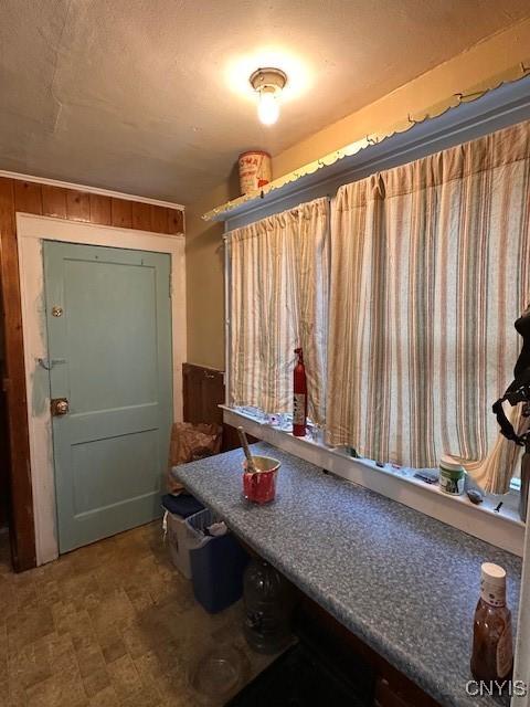 mudroom with wooden walls