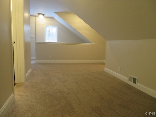 bonus room featuring carpet floors and lofted ceiling