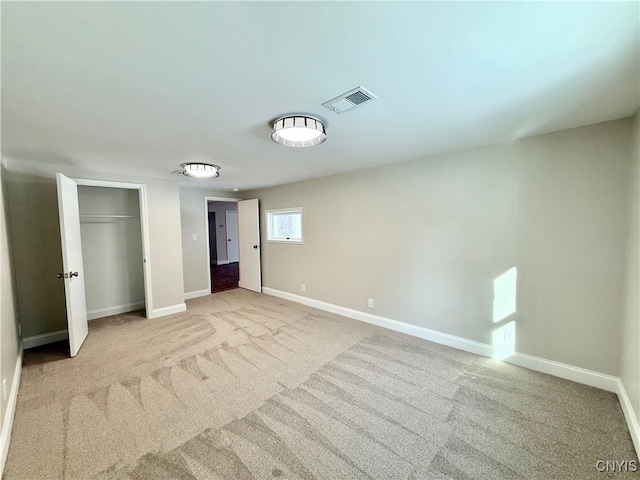 unfurnished bedroom featuring light carpet