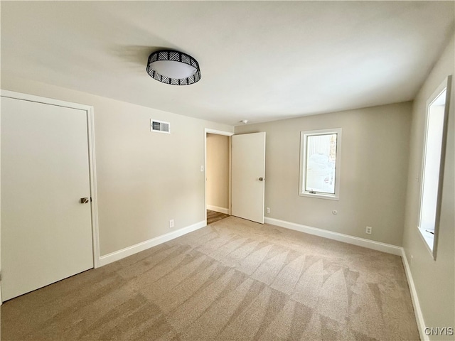 spare room featuring carpet flooring