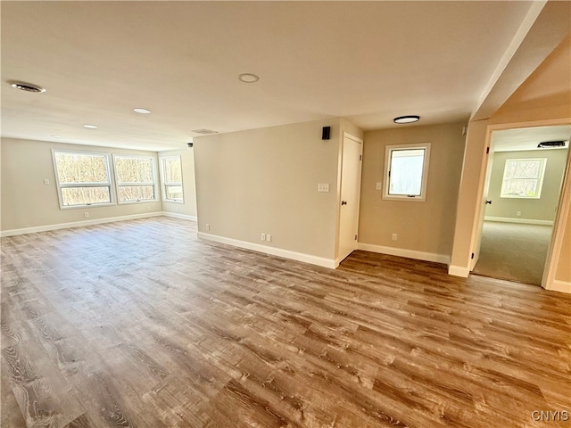 unfurnished living room with hardwood / wood-style flooring