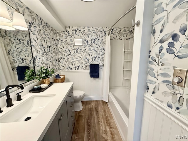 full bathroom featuring vanity, wood-type flooring,  shower combination, and toilet