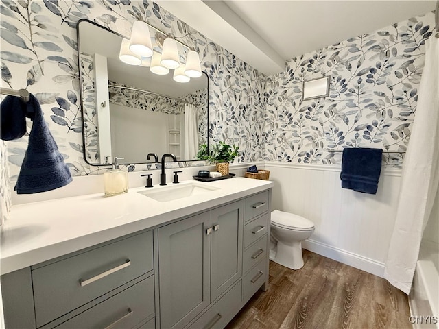 bathroom featuring a shower with curtain, vanity, toilet, and wood-type flooring