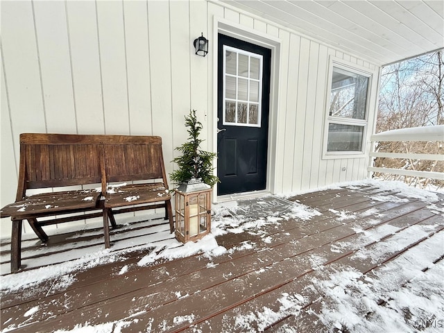 view of snow covered property entrance