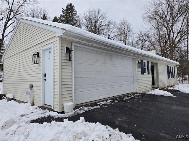 view of snow covered garage