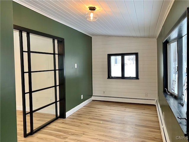 unfurnished room with a baseboard radiator, wooden ceiling, vaulted ceiling, and light wood-type flooring