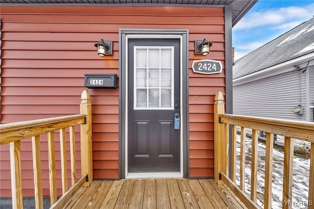 entrance to property with a deck