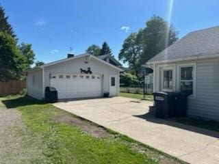 52 Maple Ave, Cohocton, NY 14826 - view of side of property featuring a garage, an outbuilding, and concrete driveway