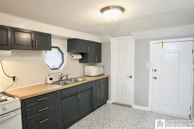 kitchen with white appliances and sink