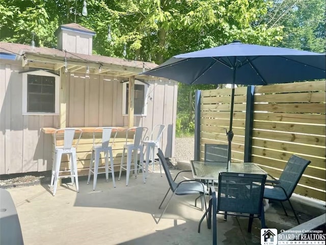 view of patio featuring an outdoor bar