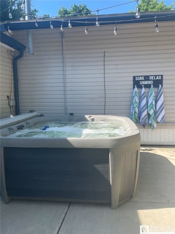 view of patio / terrace with a hot tub