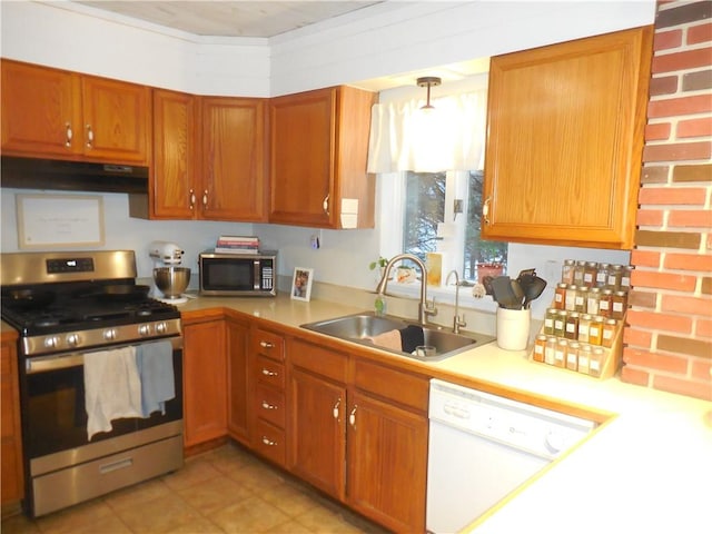 kitchen featuring pendant lighting, sink, and stainless steel appliances