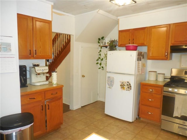 kitchen featuring white fridge and gas range