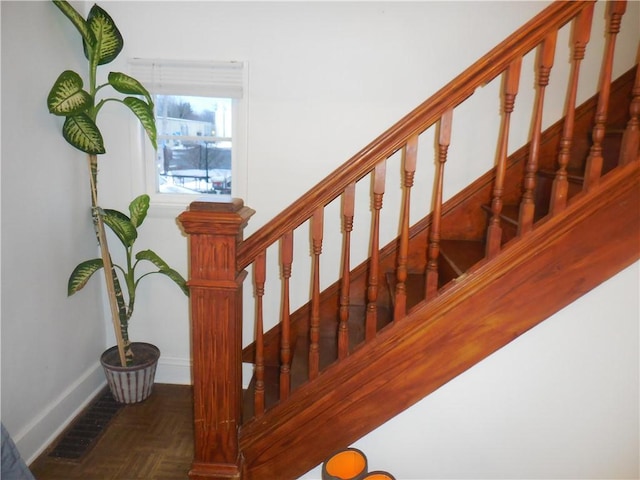 stairway with parquet flooring