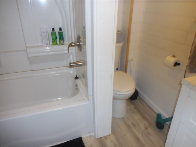 bathroom featuring toilet and wood-type flooring