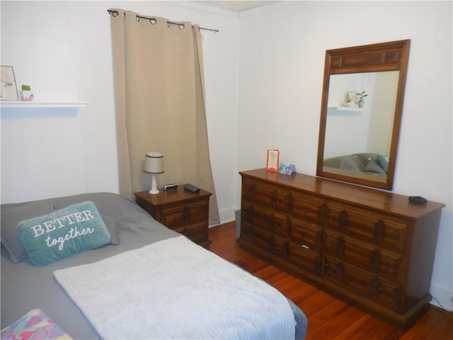 bedroom featuring dark hardwood / wood-style floors