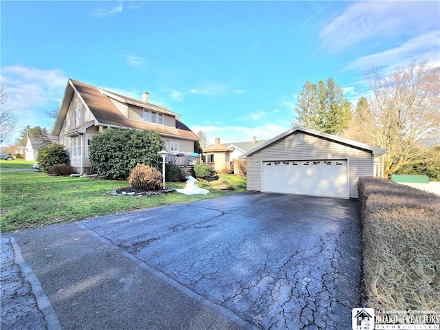 view of property exterior with a yard and a garage