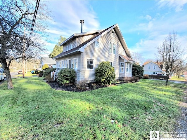 view of property exterior with a lawn