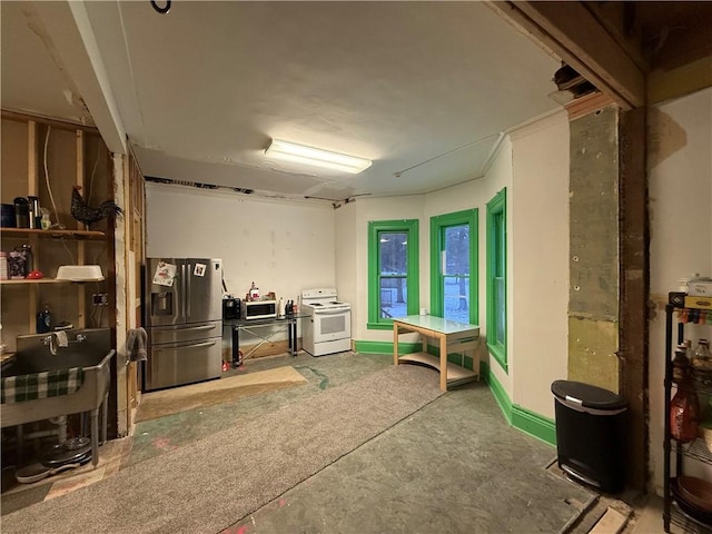 basement with stainless steel fridge