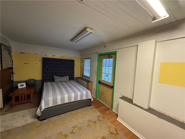 bedroom with hardwood / wood-style flooring