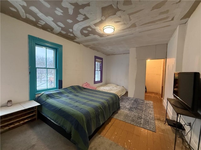 bedroom with light wood-type flooring