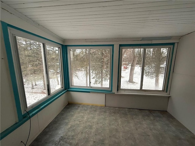 unfurnished sunroom featuring a healthy amount of sunlight