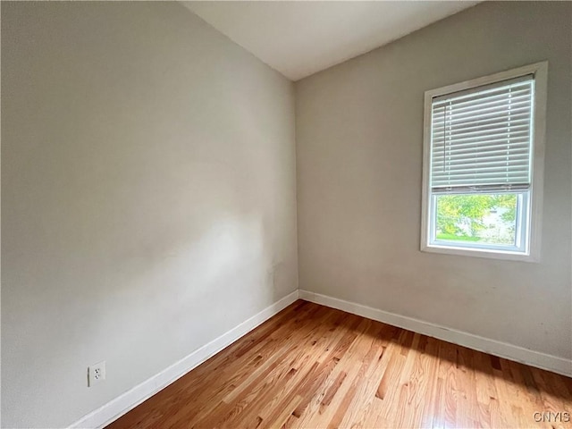 unfurnished room with light wood-type flooring