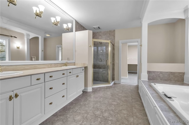 bathroom with plus walk in shower, vanity, and an inviting chandelier