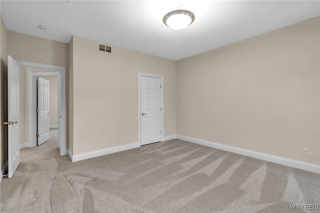 unfurnished bedroom with light carpet