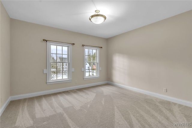 unfurnished room with carpet