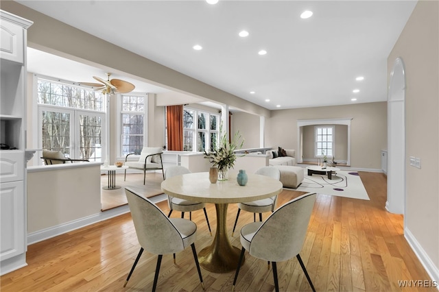 dining area featuring light hardwood / wood-style floors and ceiling fan