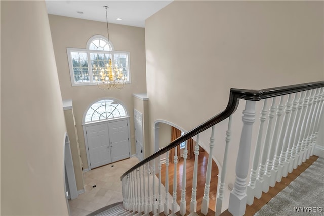 foyer entrance featuring an inviting chandelier