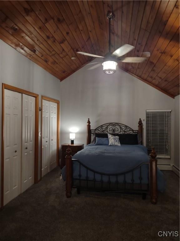 carpeted bedroom with ceiling fan, vaulted ceiling, wood ceiling, and multiple closets