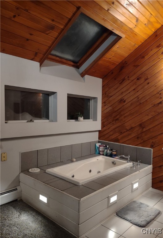 bathroom featuring tiled bath, baseboard heating, wood ceiling, and wooden walls