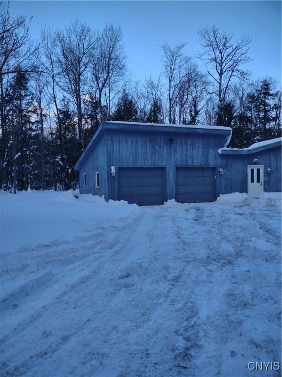 view of snow covered garage