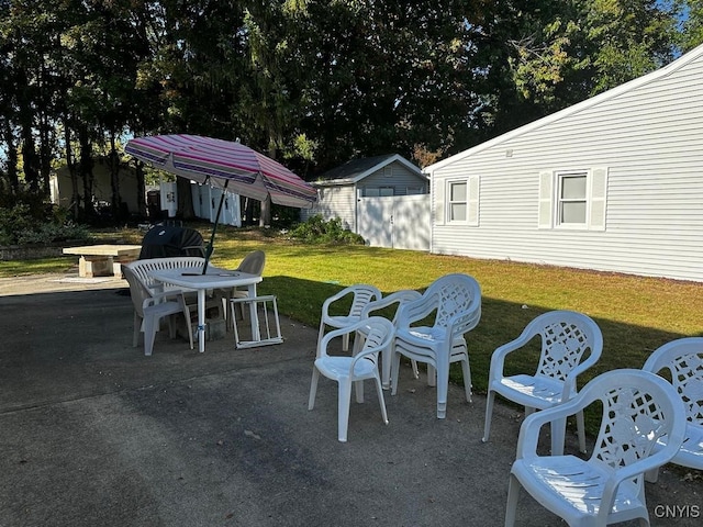 view of patio / terrace featuring a storage shed