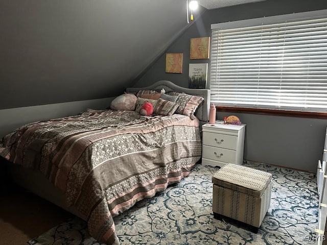 bedroom with lofted ceiling