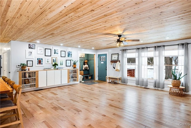 interior space with ceiling fan, wood ceiling, and light hardwood / wood-style flooring