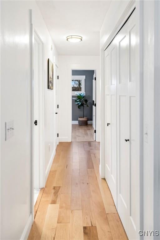 hall with light wood-type flooring