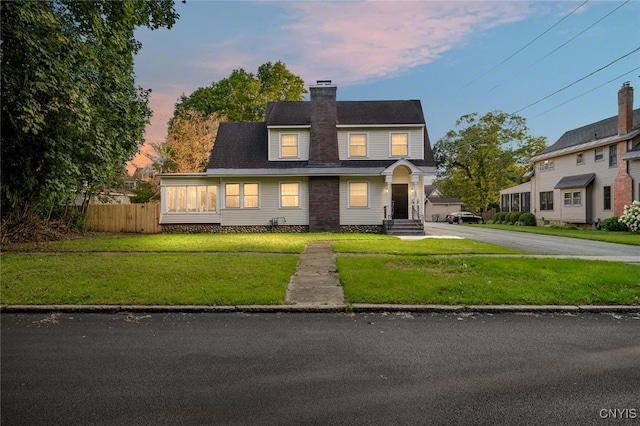 view of front of property with a yard