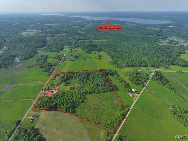 birds eye view of property with a rural view