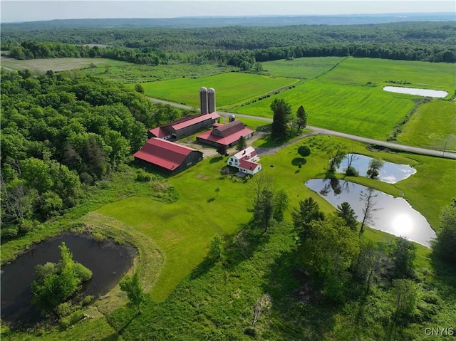 aerial view with a rural view and a water view