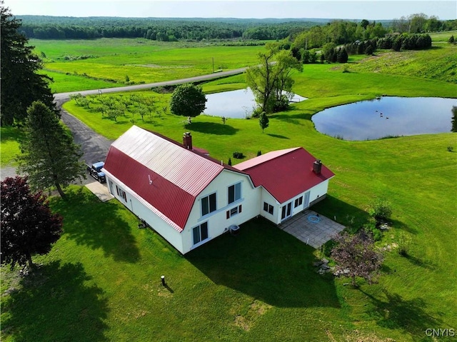 drone / aerial view featuring a rural view and a water view