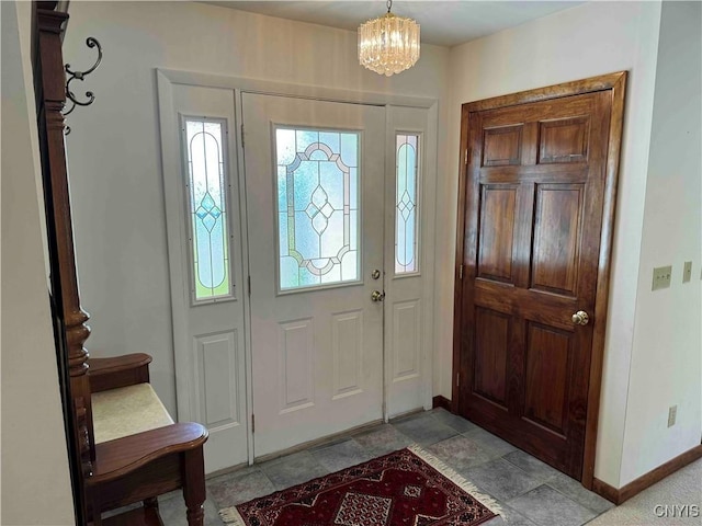 foyer entrance with a chandelier