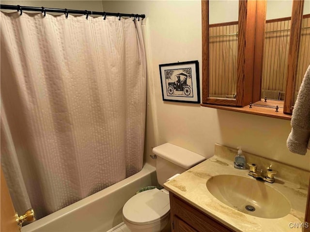 full bathroom featuring vanity, toilet, and shower / bath combo with shower curtain