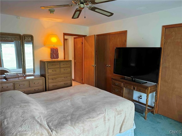 carpeted bedroom with ceiling fan